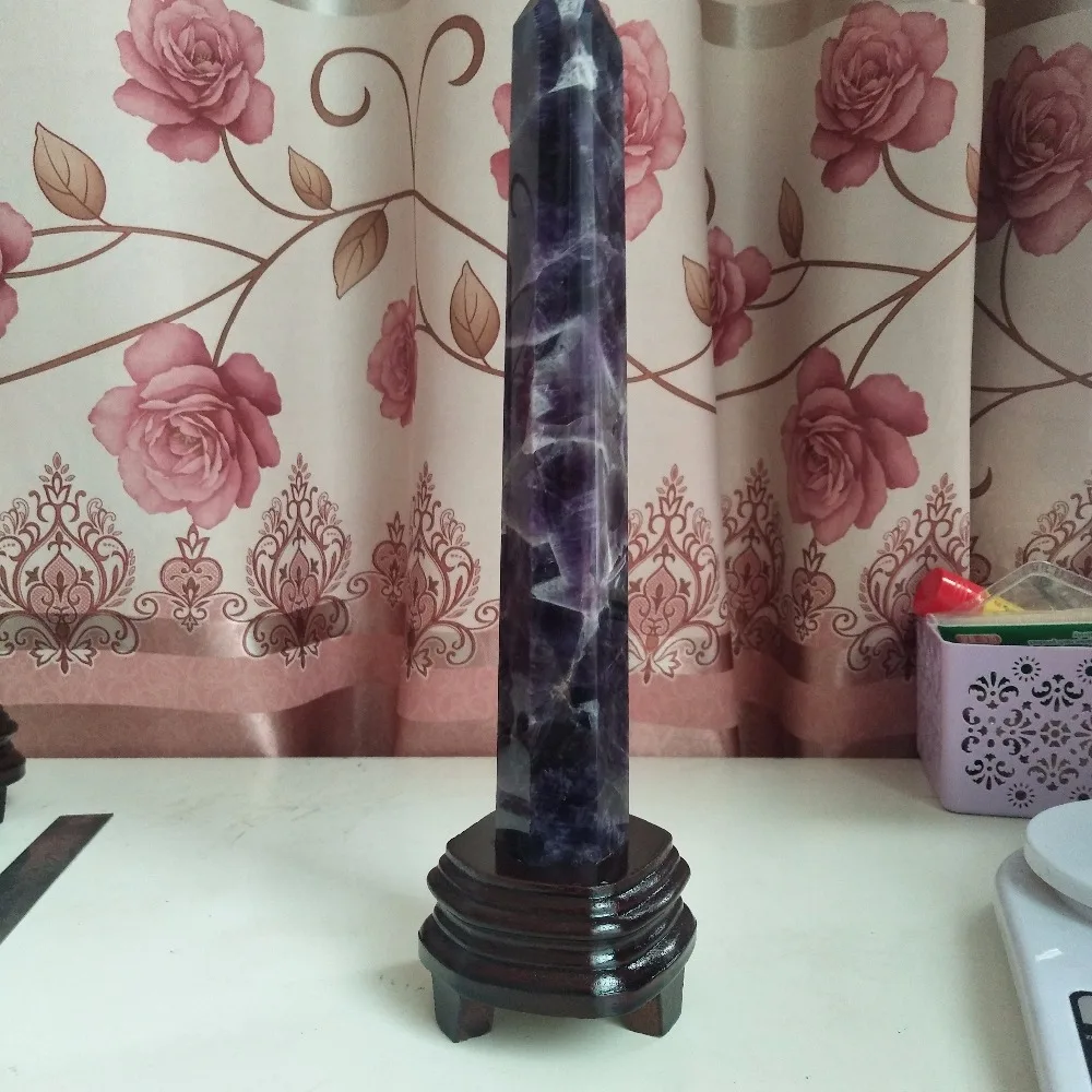 

A 345mm natural fantasy amethyst wand dot decorates the quartz obelisk and crystal tower with ultra high healing crystals