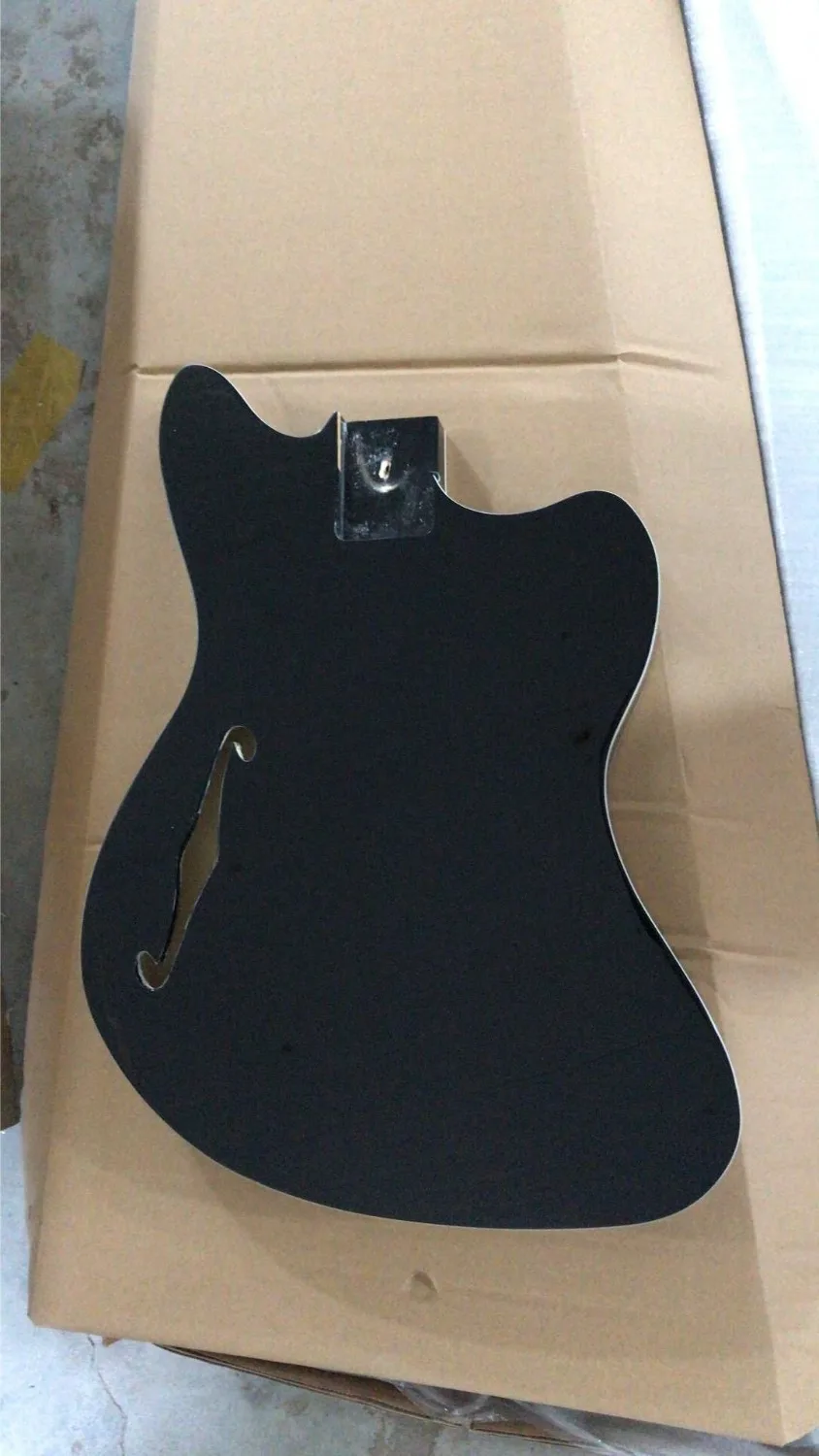 

guitar body just the f hole and neck pocket in black