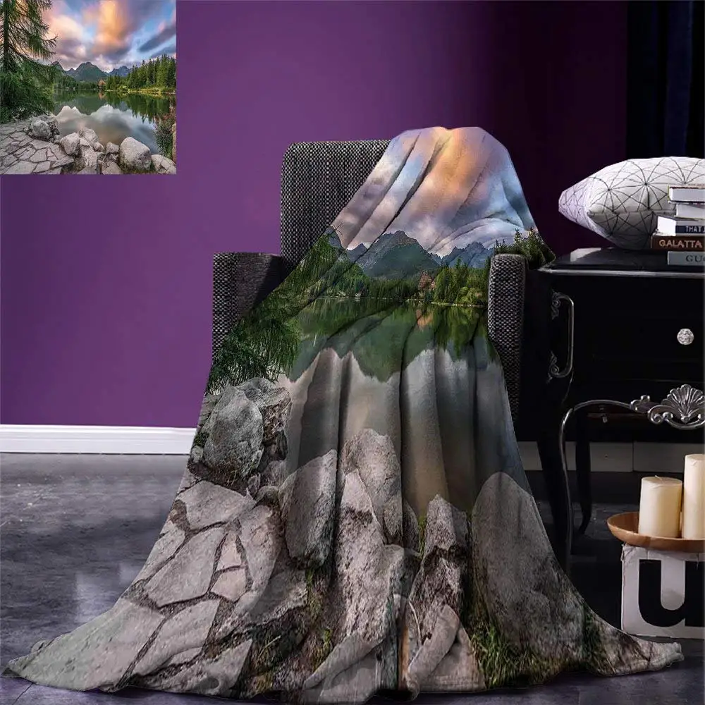 Mountain Blanket Idyllic View with Tree on Still Lake Surrounded by Mountains and Moody Sky