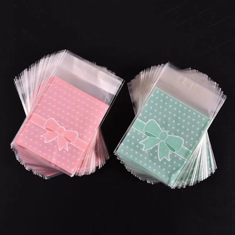 

100Pcs Lovely Pink Blue Bow Adhesive Cake gift Packages Gift Sealing OPP Plastic Cookie Candy Pack Paper bags