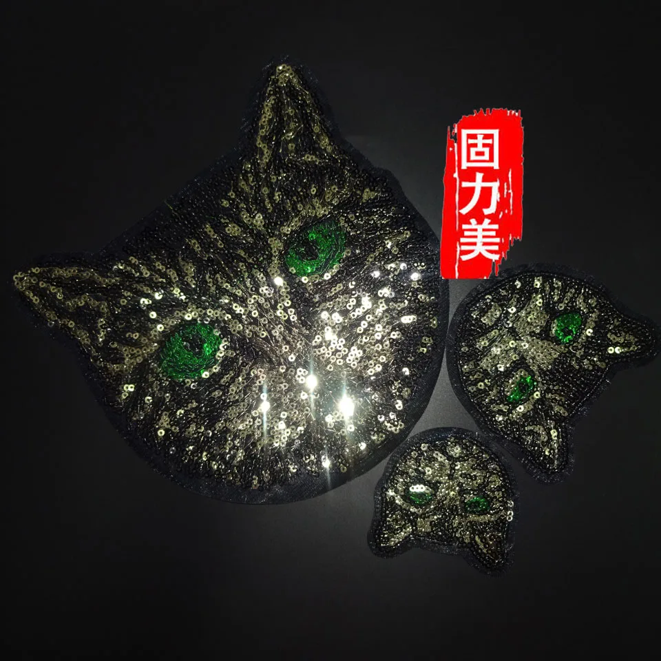 

2pc lovely cartoon green eyes black gold cat head sequins Applique iron On Patch for Clothing bag T-shirt coat etc