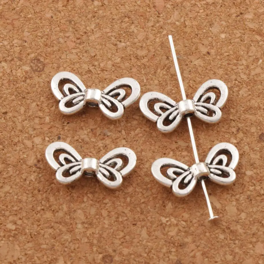 

Hollow Butterfly Bow Animal Charm Beads Spacers Jewelry Findings L688 35pcs 17.4x9.3mm Tibetan Silver