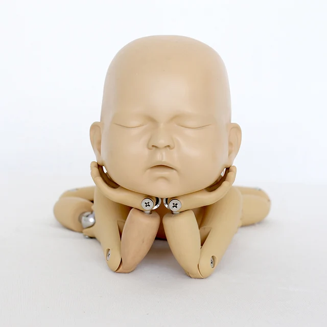 newborn posing doll
