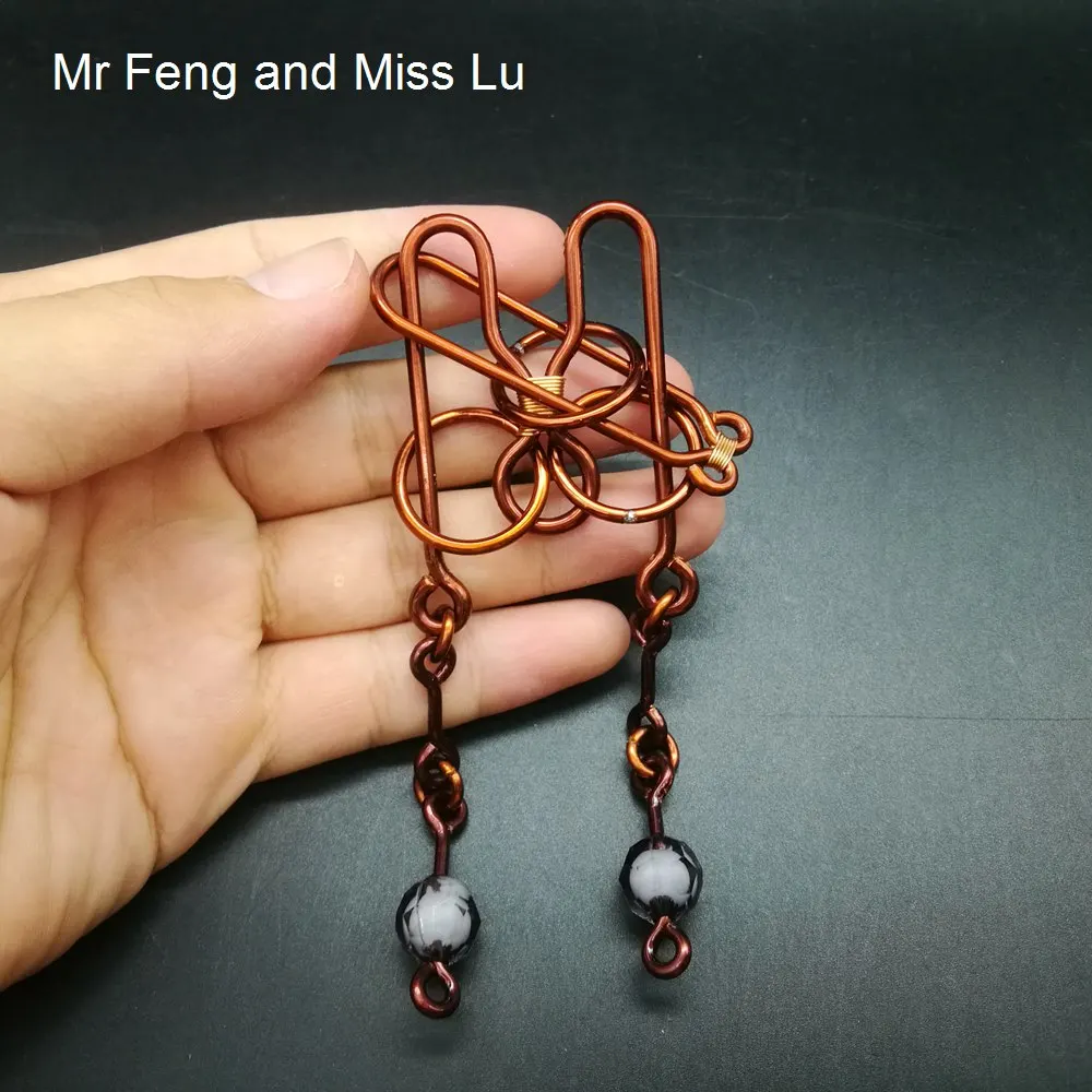 

Red Copper Hand Made Wire Puzzle Handcraft Toy Brain Teaser Learning Education