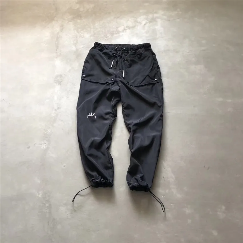 

Black A-Cold-Wall* Pants 19ss Exclusive Teohnial Nylon Track Pants Button Big Pockets Leg-tied A-Cold-Wall Trousers Men ACW