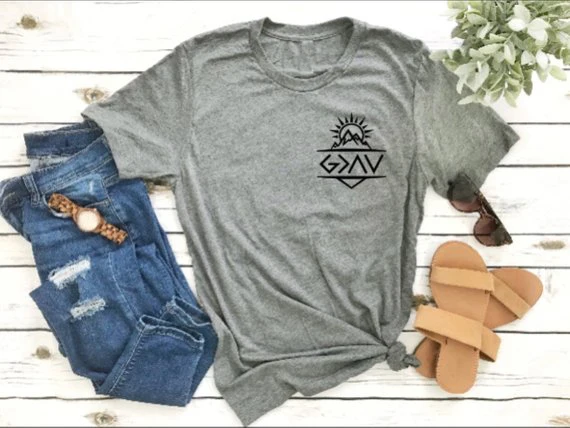 

God is Greater Than the Highs and Lows Graphic T-Shirt Pocket Religion Christian Cute Tee Aesthetic Gray Girl Clothing Tops