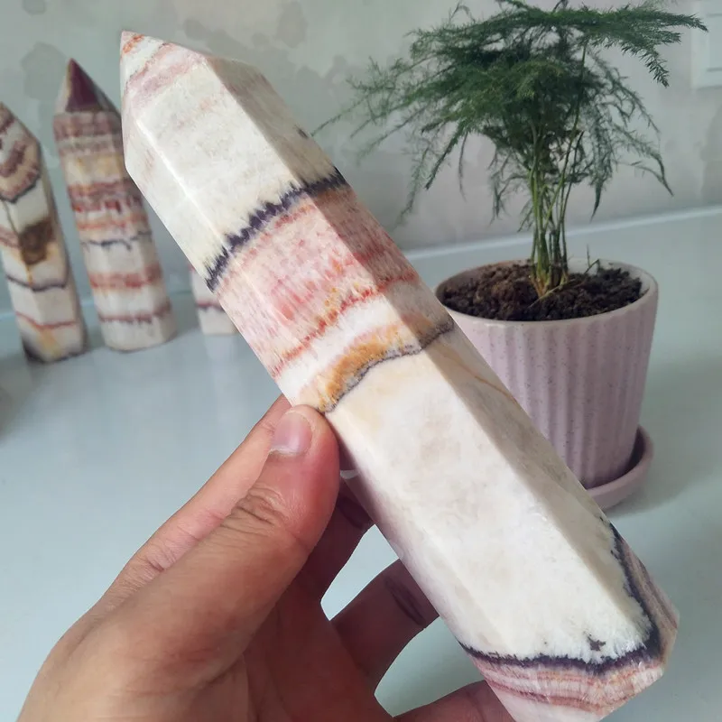 A Oversized stone wand point natural rhododendron crystal decorated obelisk and hexagonal crystal point healing crystals