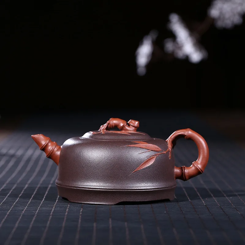 

Quality Goods Famous Manual Raw Ore Two Colors Of Purple Clay Bamboo Joint Kettle Kungfu Online Teapot Tea Set Wholesale