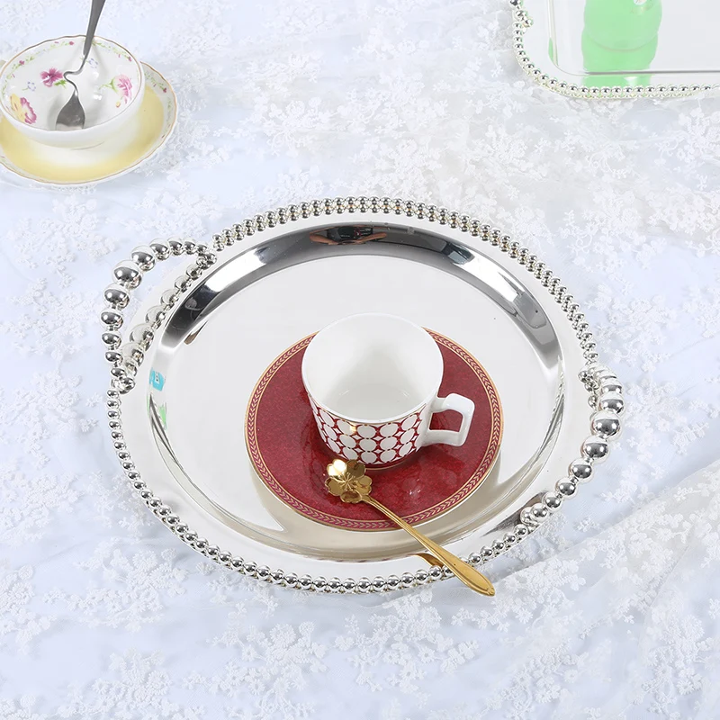 https://ae01.alicdn.com/kf/HTB1ujSiHACWBuNjy0Faq6xUlXXa4/12-Deluxe-Round-Silver-Serving-Tray-Decorative-Metal-Dinner-Platter-Cake-Stand-Fruit-Plate-Dinnerware-for.jpg