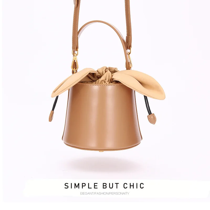 

The niche design leather bag bucket bag female 2019 new bow bow single shoulder slant slant hand bag
