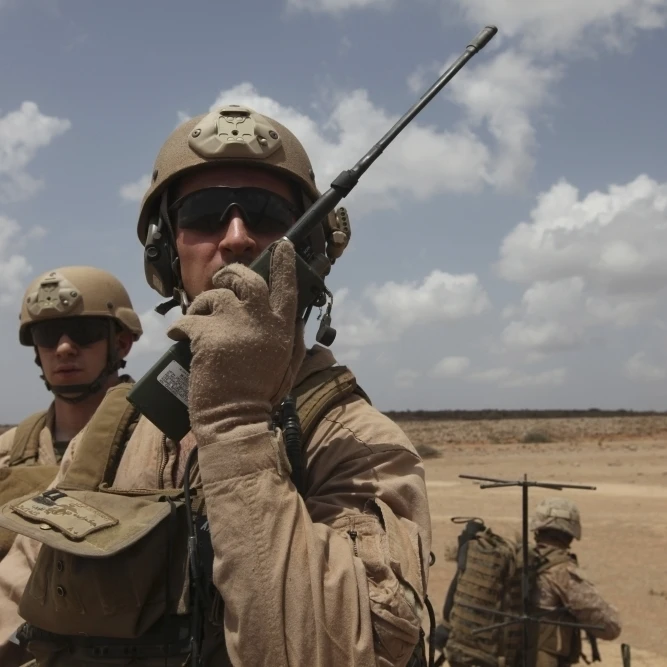 U.S. Marine uses a radio in Djibouti Poster Print (34 x 22)