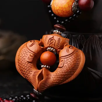 

(3pcs)Double fish solid wood carvings of the concentric fish high-grade peach wood car upholstery car hangs the wind bell.