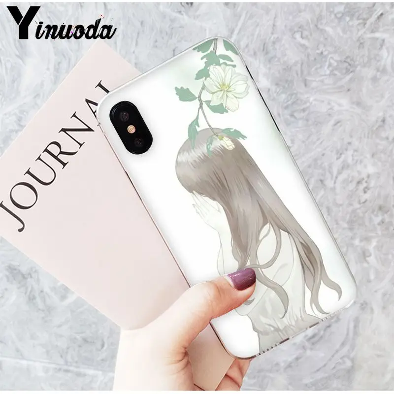 Long haired girl back view plant flowers