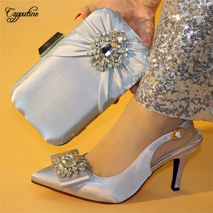 

Elegant silver thin heel pointed toe shoes matching with purse handbag set for evening party A168-28