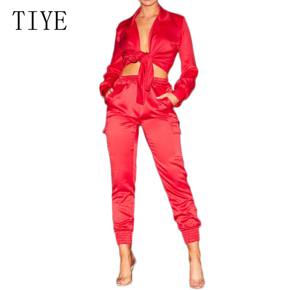 TIYE Elegant Satin Bodycon Bandage Jumpsuit Women 2019 Autumn Long Sleeve Solid Lapel Deep V Neck Pockets Playsuits Streetwear TIYE Elegant Satin Bodycon Bandage Jumpsuit Women 2019 Autumn Long Sleeve Solid Lapel Deep V Neck Pockets Playsuits Streetwear