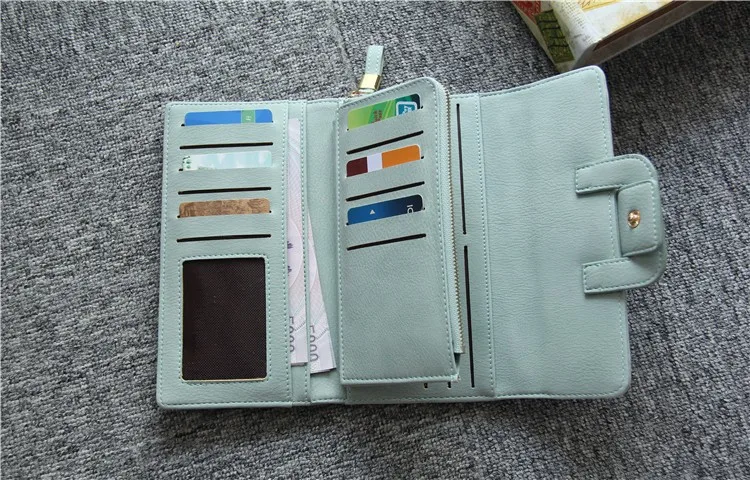 Multi-card holder long wallet lifestyle shot carried as clutch