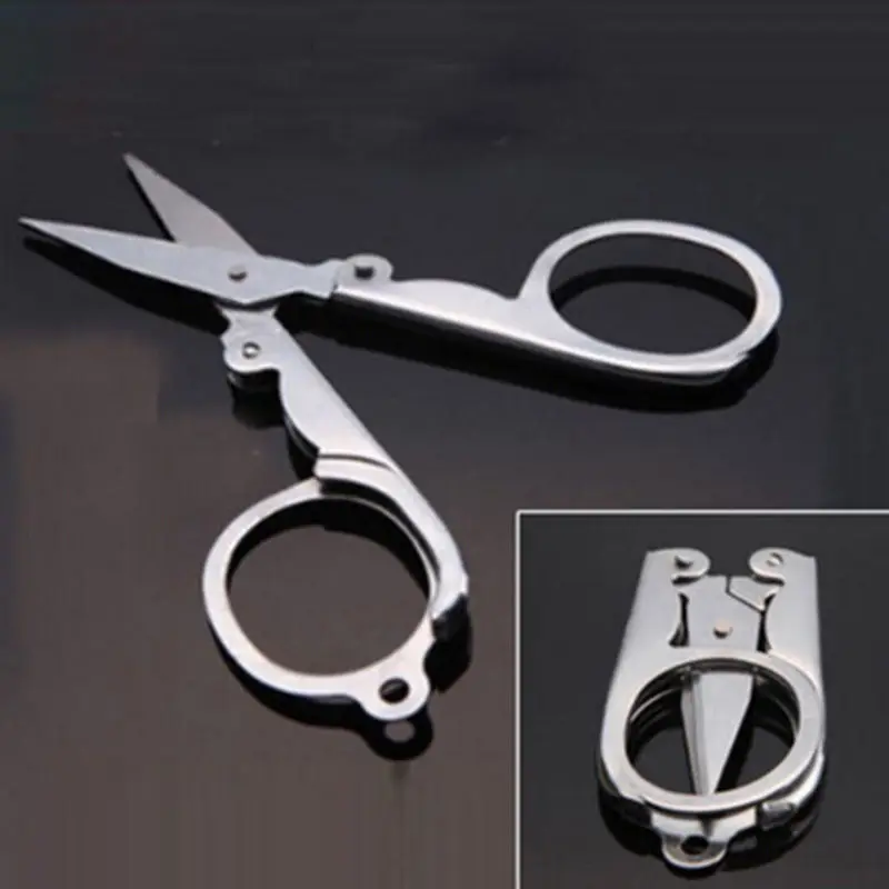 

Hot Sale Titanium Steel Material Portable Mini folding Scissors Pocket Travel Scissors Easy and portable to carry suitable