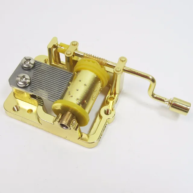Golden hand cranked Music box musical mechanism Hedwig's theme Game of