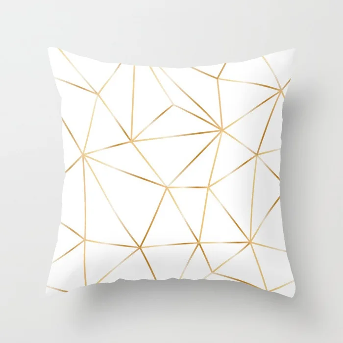 gold-polygon-on-white-pillows