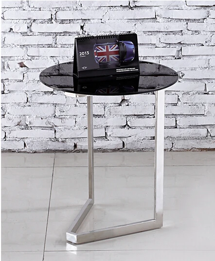 Contemporary and contracted toughened glass. The phone. The sofa side table.