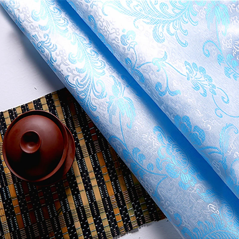 

High quality brocade jacquard polyester white background blue Phoenix Tail fabric for patchwork tissue women dress by 100x90