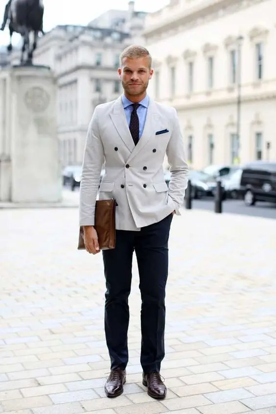 beige jacket blue trousers