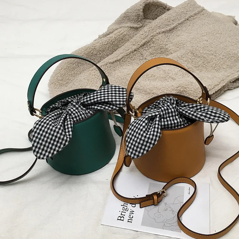 النساء بو الجلود حقيبة يد الشهيرة مصمم جديد الأزياء دلو حقيبة Crossbody حقيبة عبر القوس النساء حقيبة كتف النساء بو الجلود حقيبة يد الشهيرة مصمم جديد الأزياء دلو حقيبة Crossbody حقيبة عبر القوس النساء حقيبة كتف