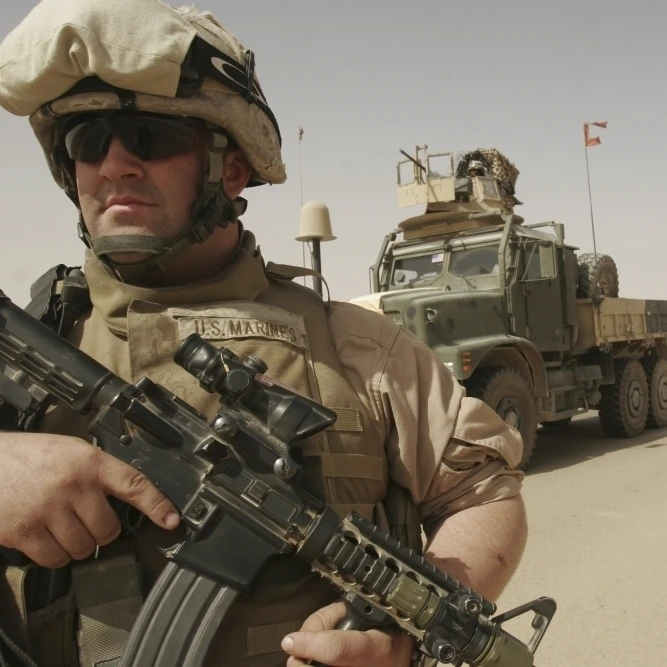 U.S. Marine keeping his weapon ready as he performs a dismounted patrol in Al Asad  Iraq Poster Print (17 x 11)