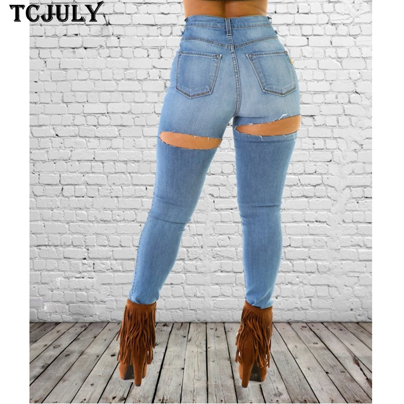 Female legs and knees in torn jeans. Fashionable denim clothing for girls.  Pants with holes, hipster, street fashion Stock Photo | Adobe Stock