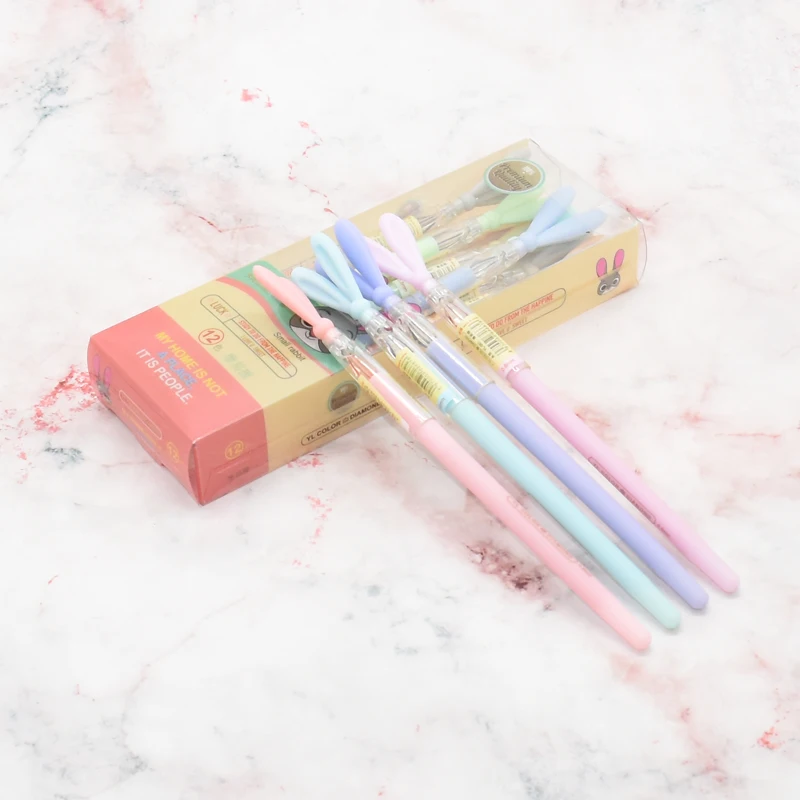 

A box of stationery rabbit ear style gel pen, cartoon 12 color brick stone pen
