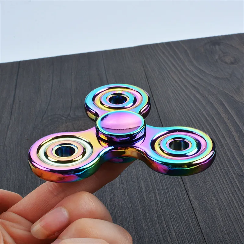 Fingers rotate toy metal triangle fingertips spinning children's adult