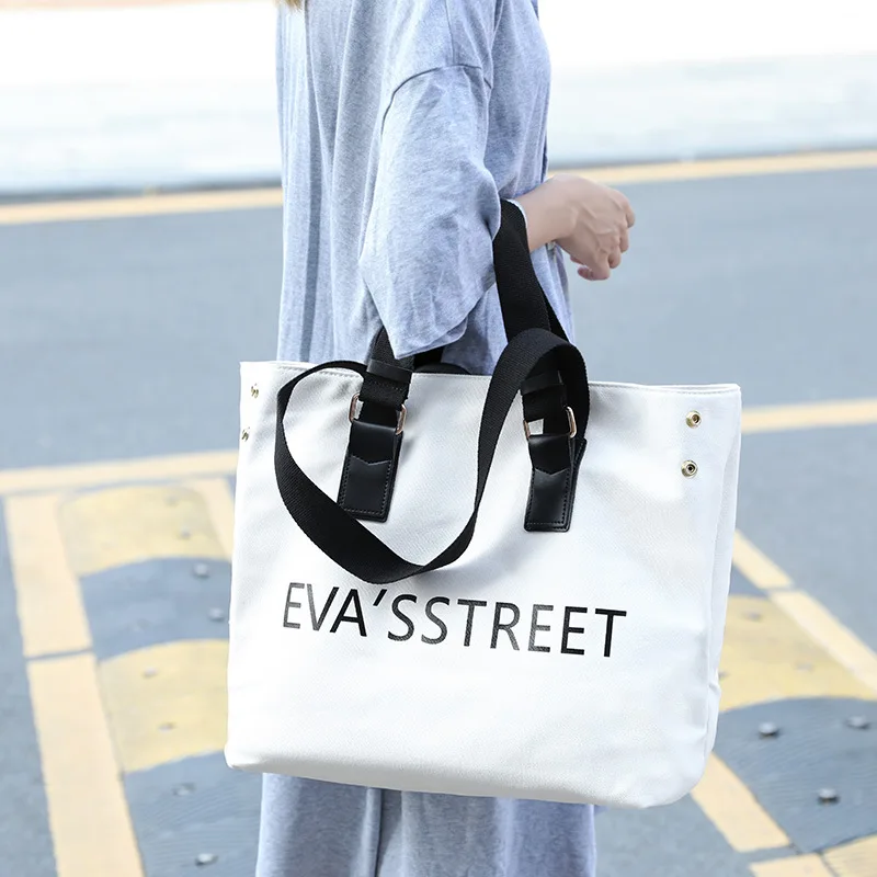 

2018 new casual portable canvas bag female letter decorative shoulder bag Messenger bag.