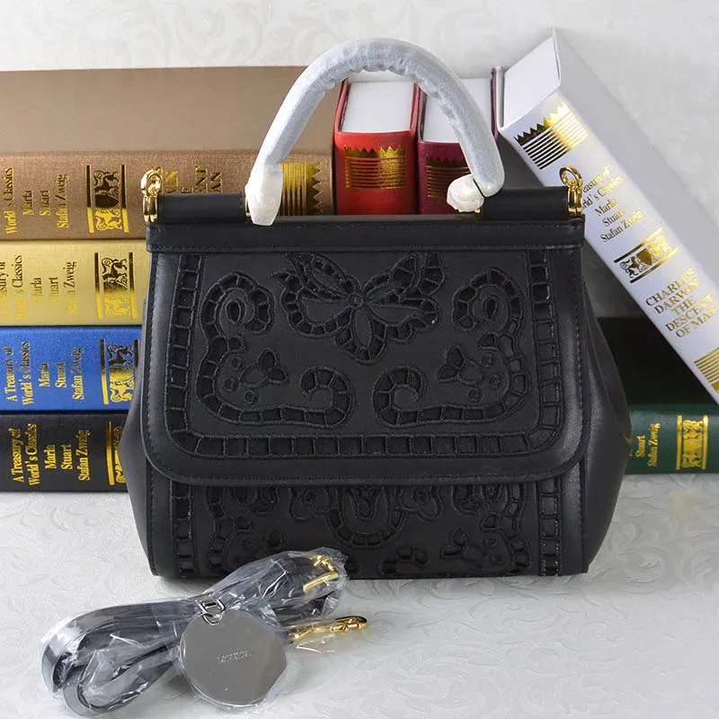 2016 new European spring fashion handbags leather openwork embroidery