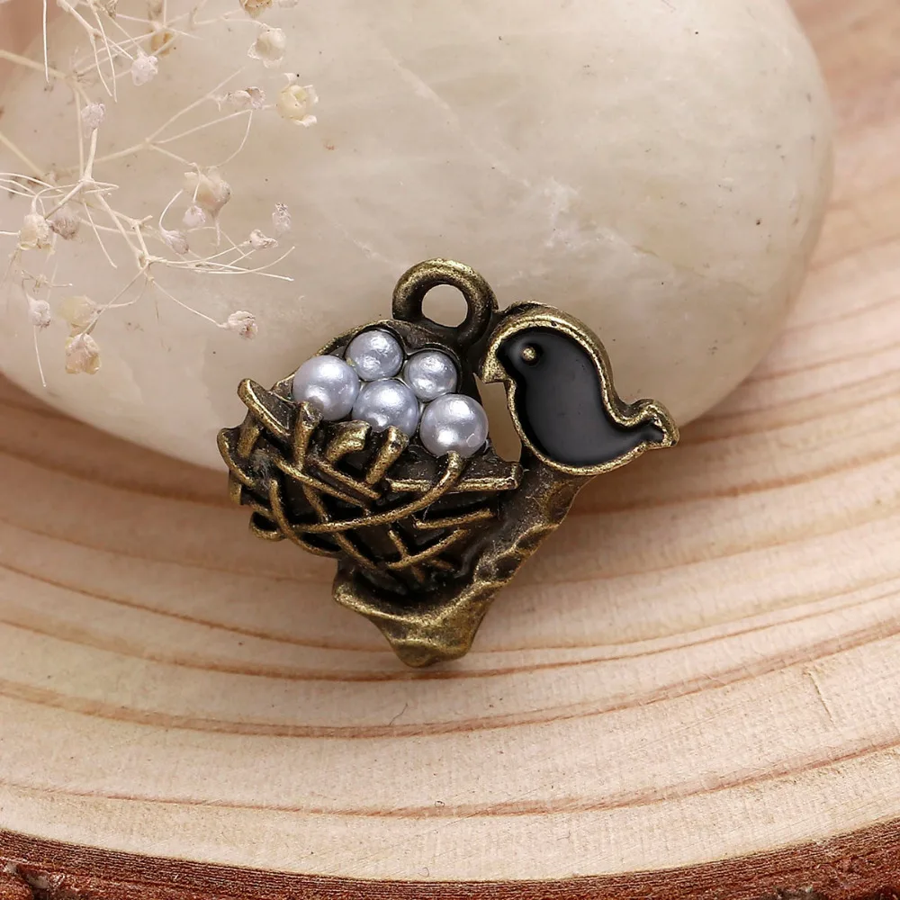 

DoreenBeads Zinc Based Alloy Antique Bronze Charms Mother Bird White Acrylic Black Enamel Black Nest Inlaid 21mmx 20mm, 5 PCs