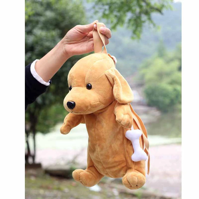 chihuahua soft toy in a bag