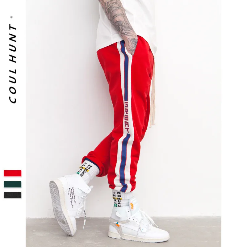 men's green track pants with red stripe