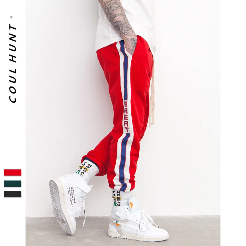 green with red stripe track pants