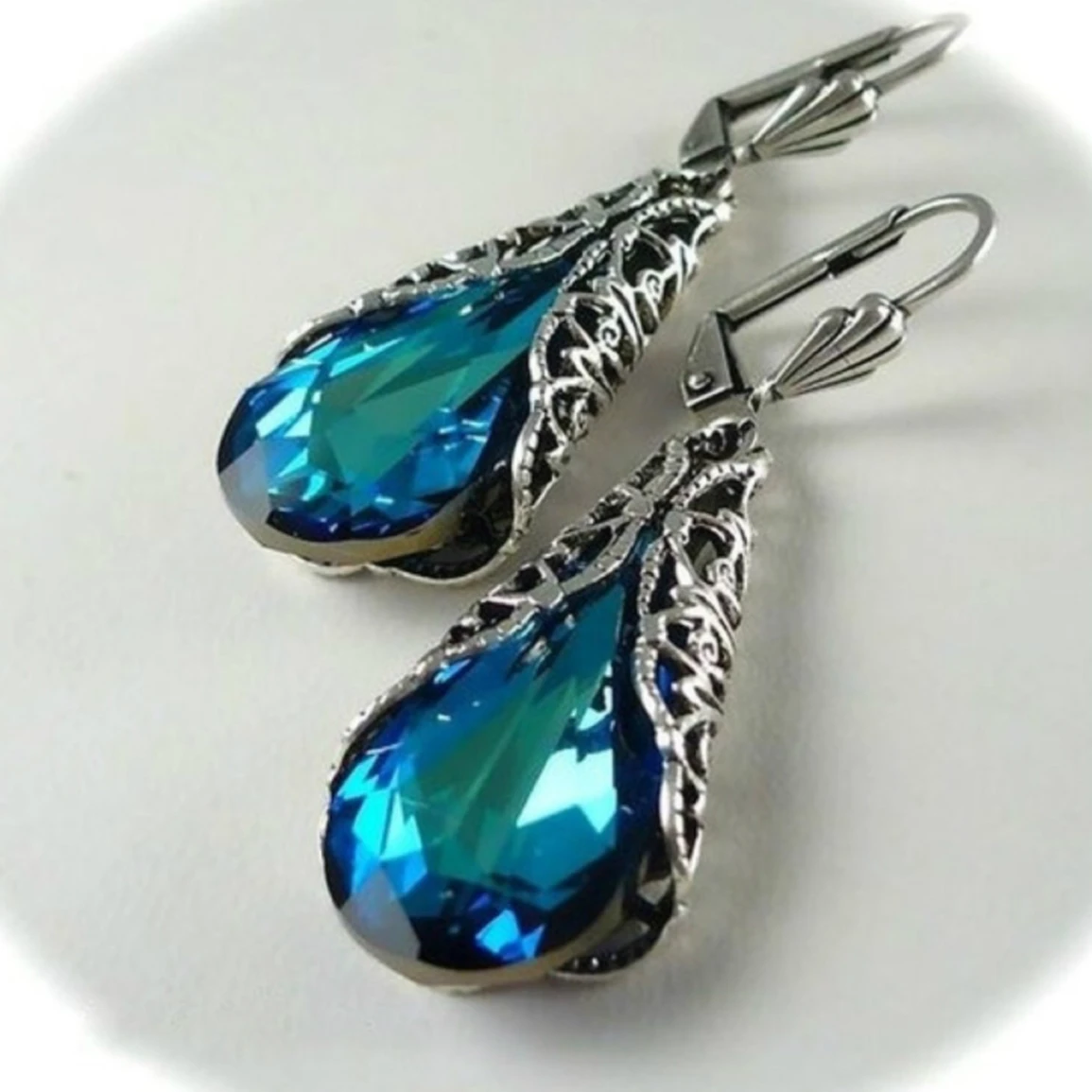 

Blue crystal earrings hollow design classical palace style ladies elegant earrings