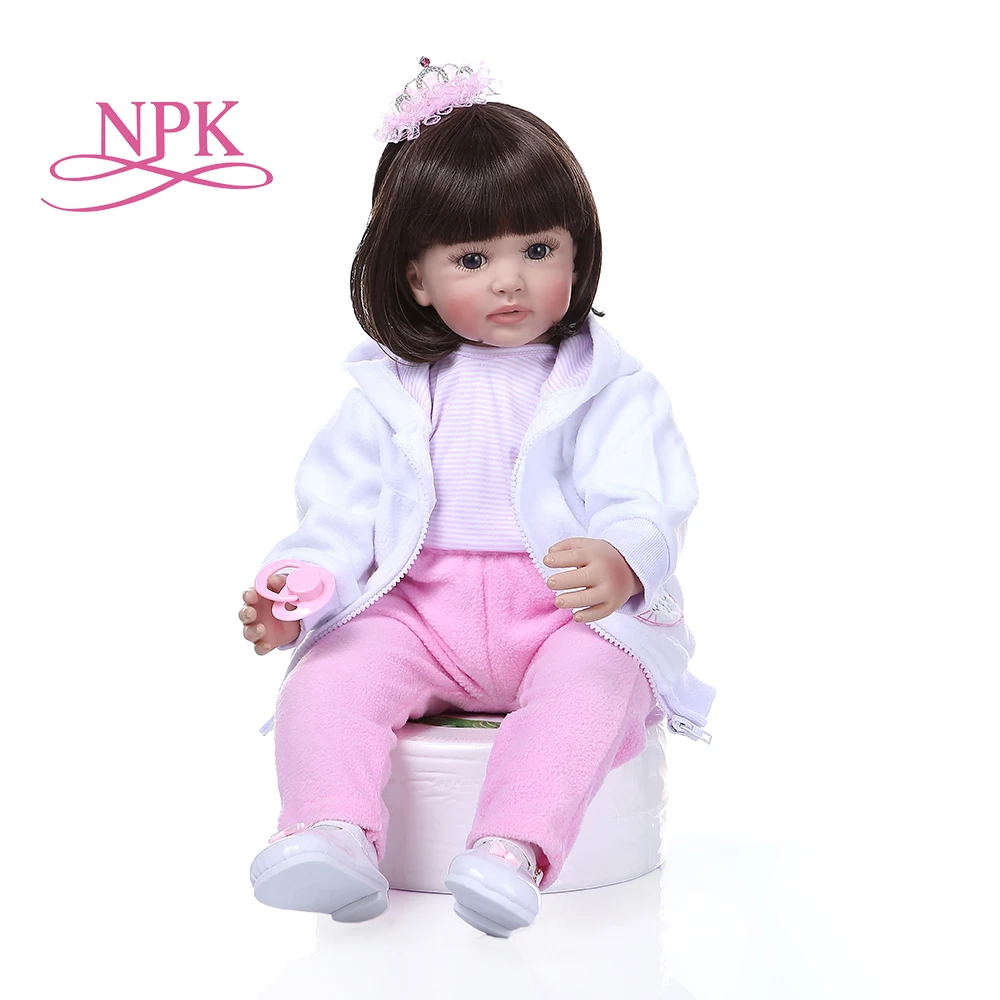 

NPK 60CM lifelike reborn toddler baby silicone girl doll with short dark student hair in white cat dress doll toy Christmas Gift
