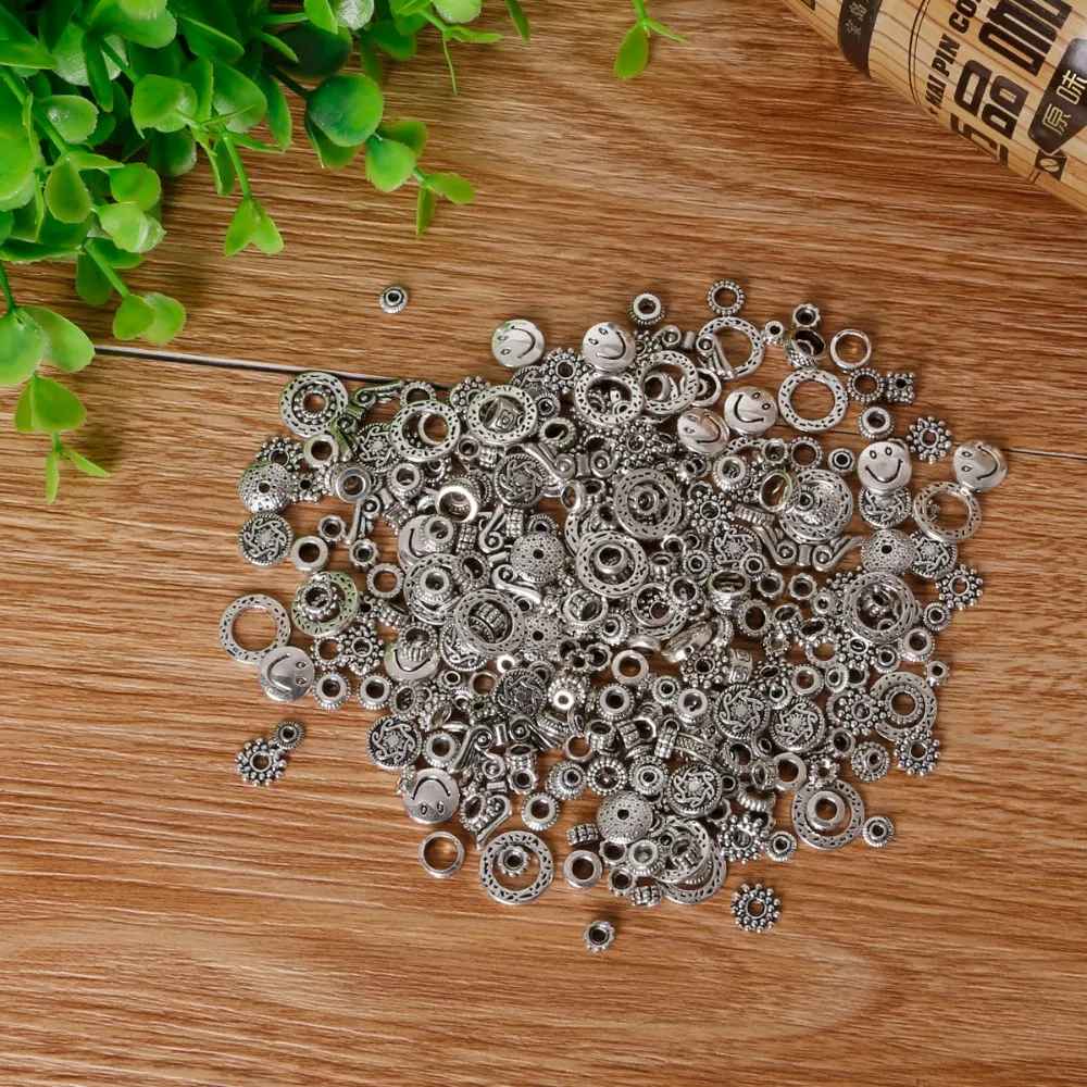 

Hot Sale 50g Randomly Mixed Tibet Silver Plated Zinc Alloy Charms Beads Spacer Beads Fit European Bracelet Necklace DIY Beads