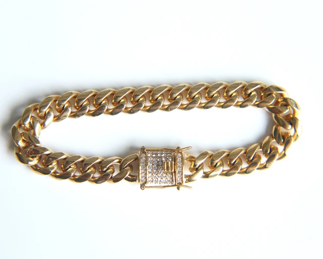 A heavy curb link bracelet in 9ct yellow gold, with thre… | Drouot.com