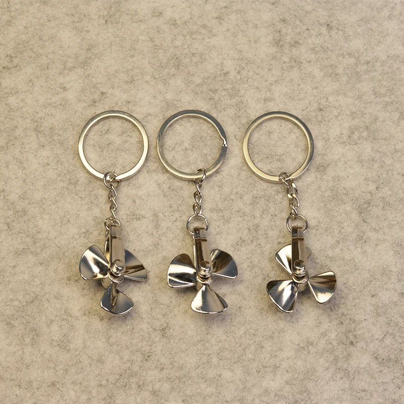 

8pcs Creative rotatable metal alloy propeller car keychain Relieve stress fan leaf wind mill key ring Auto Accessories
