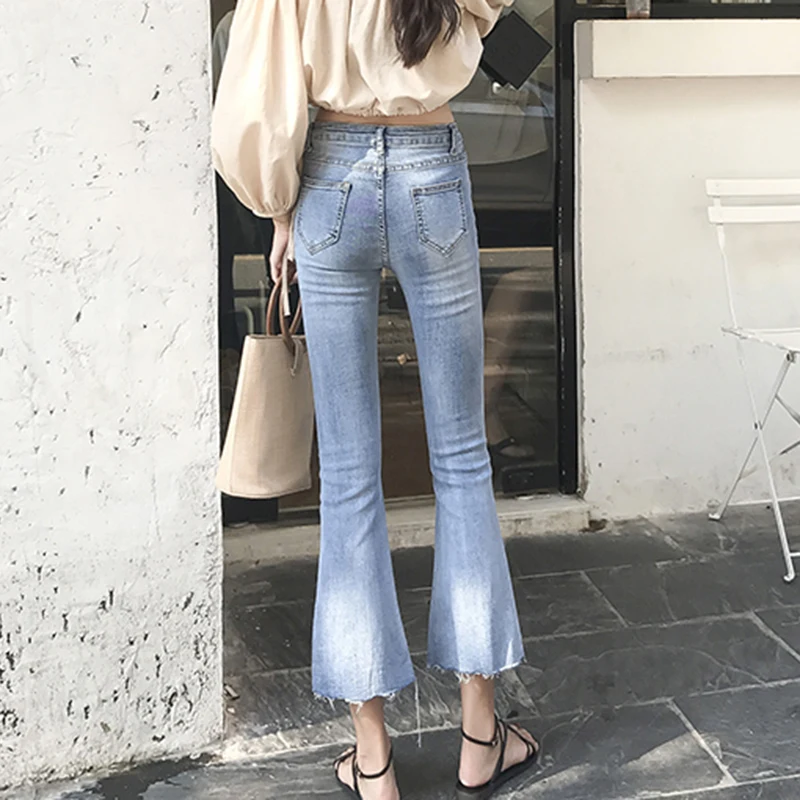2019 modis spring summer Slim high waist sexy irregular ladies jeans Wide leg pants Korean nine bell bottom mom jeans women