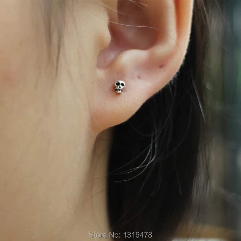 

Neutral section 925 sterling silver mini exquisite skull ear bone nail small wild personality men female silver stud earring jew