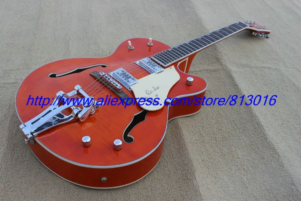 

Hot ! customised electric guitar howllo jazz body,orange see thru, chrome parts,with bigby tail,3pcs neck,high grade!