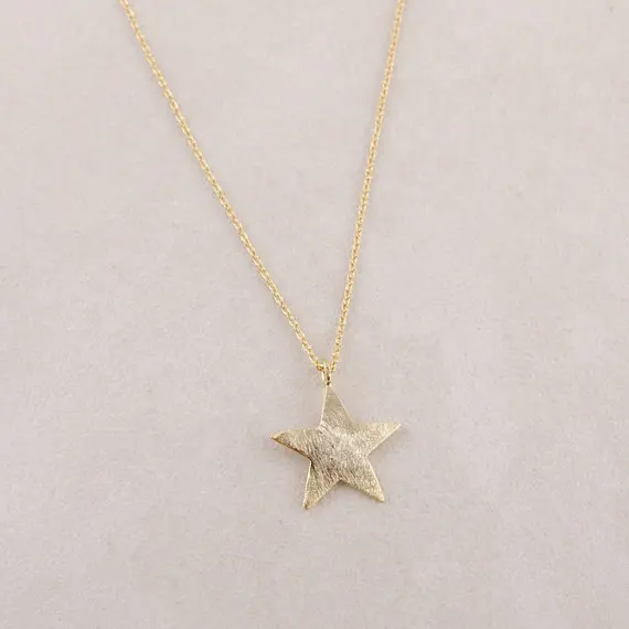 Brushed Star Necklace in Gold.jpg