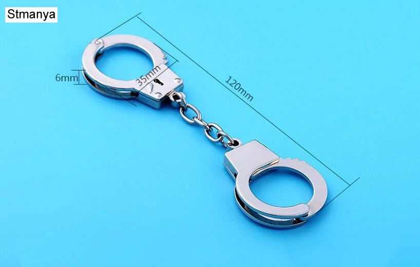 Брелок наручники. Маленькие наручники. Брелок наручники. Брелок наручники. Игрушечные железные наручники с ключами.