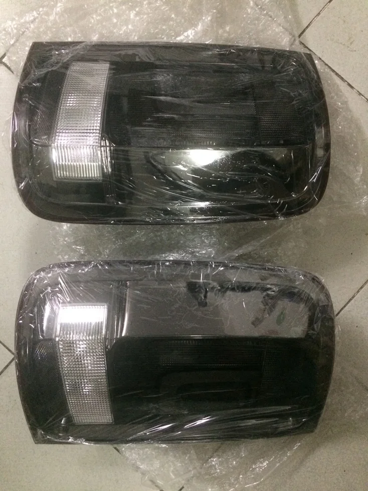 

For VW Amarok 2012- Smoke Tail Lights Rear Lamps PAIR Left + Right