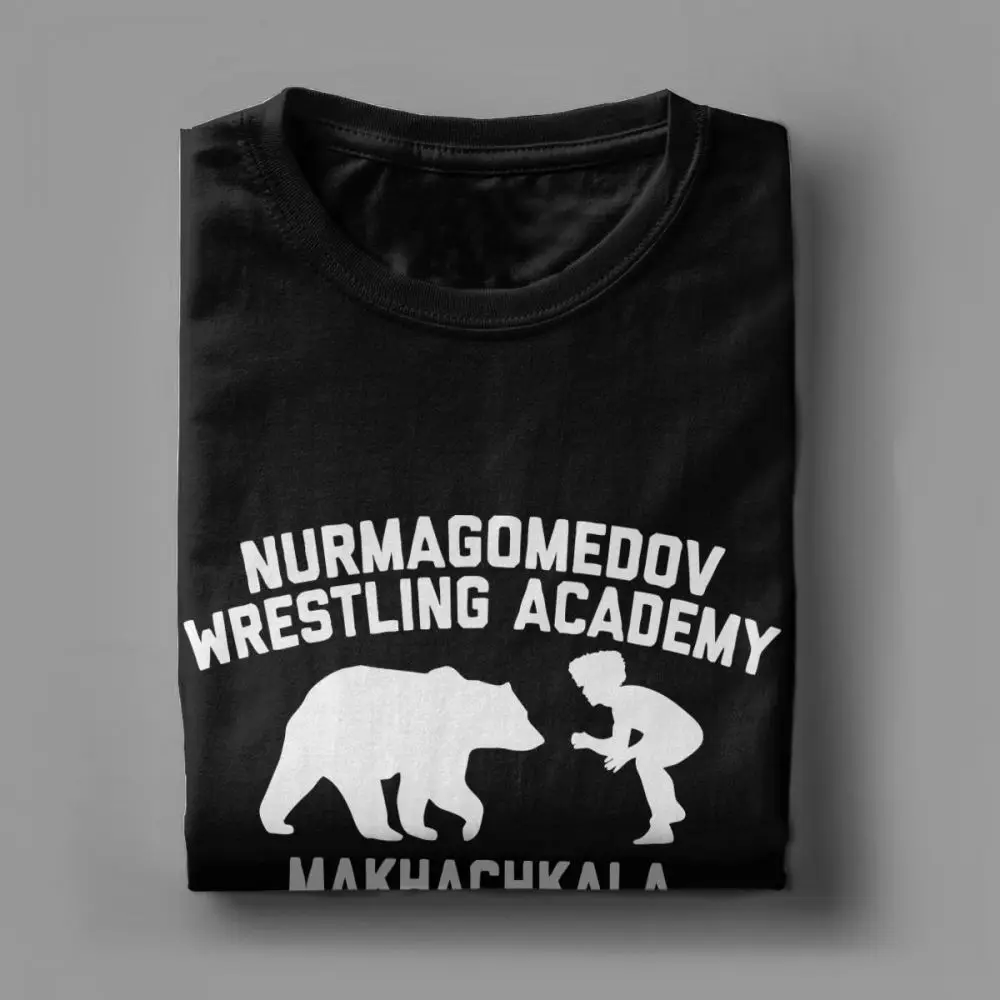 Khabib Nurmagomedov المصارعة أكاديمية تي شيرت للرجال MMA قصيرة الأكمام مضحك تيز Crewneck النقي ملابس قطنية تصميم T قميص Khabib Nurmagomedov المصارعة أكاديمية تي شيرت للرجال MMA قصيرة الأكمام مضحك تيز Crewneck النقي ملابس قطنية تصميم T قميص