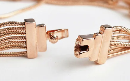 Розовое золото цвет фирменный дизайн разноцветные австрийские стразы кисточки женский браслет-манжет оптом подарок